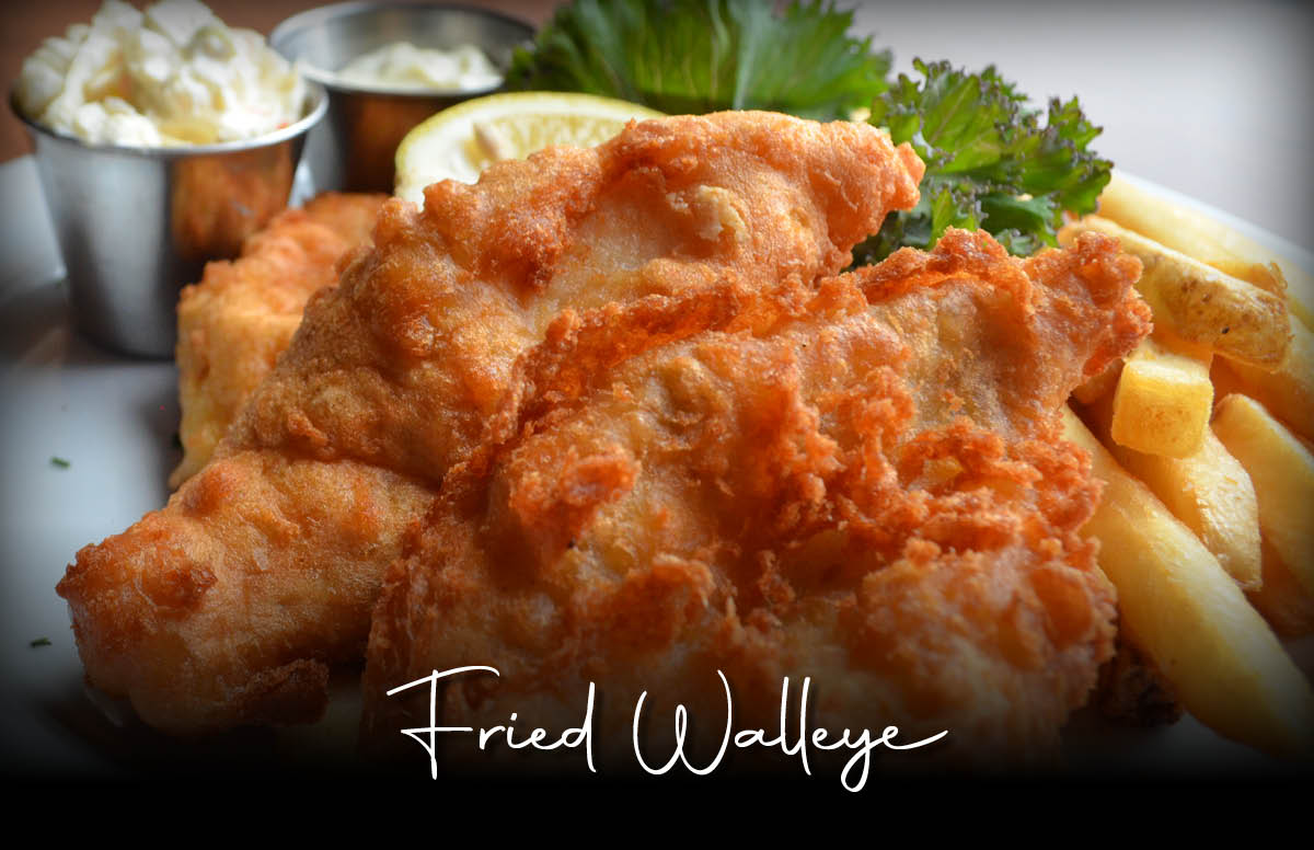 Fried walleye served with fries and coleslaw.